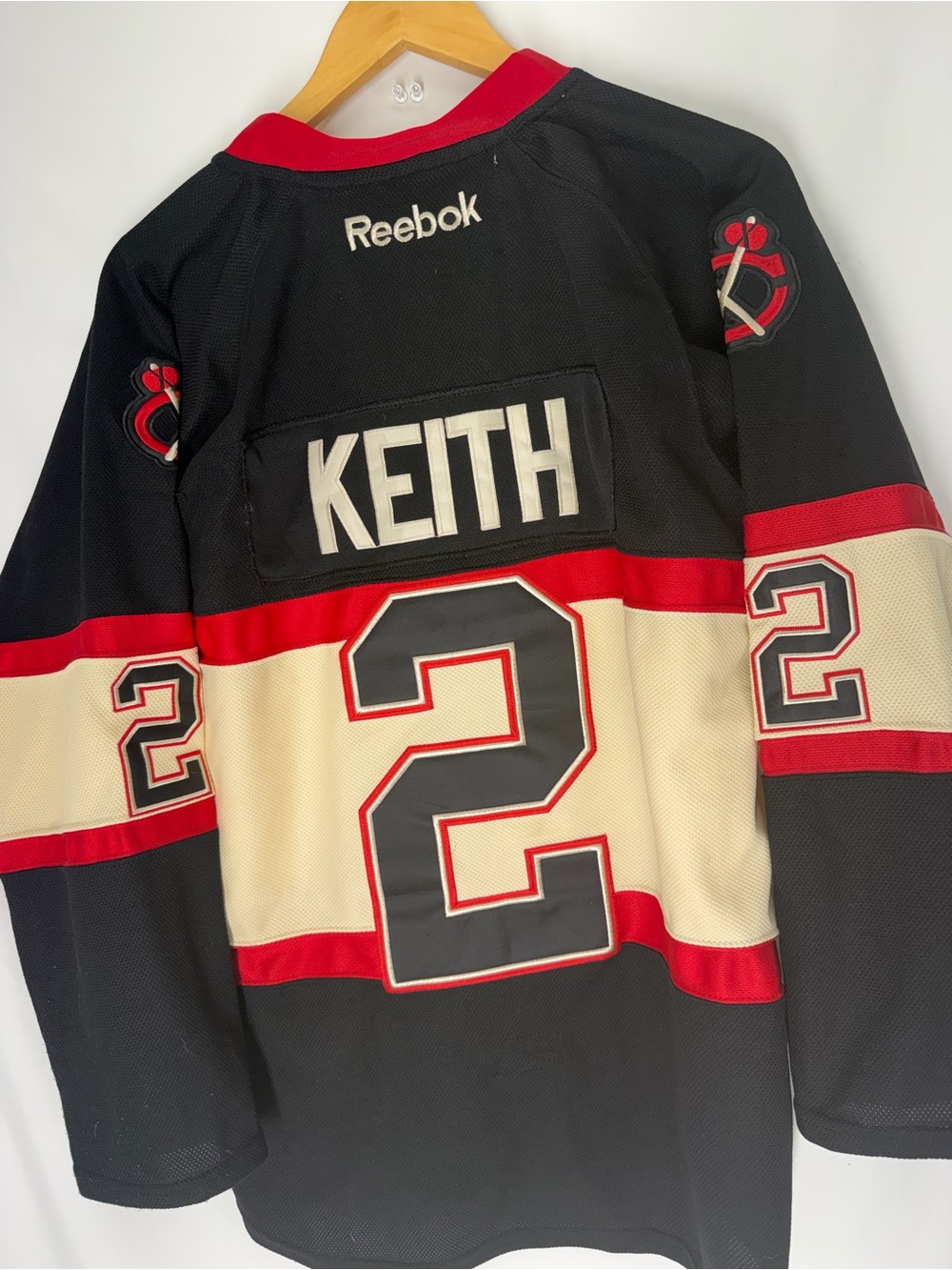 Reebok Men’s Keith #2 Black, Cream & Red Hockey Jersey